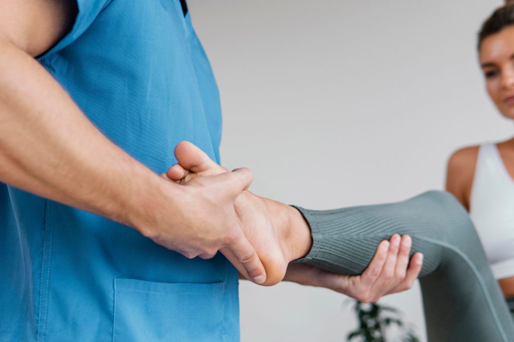 doctor stretching patients leg